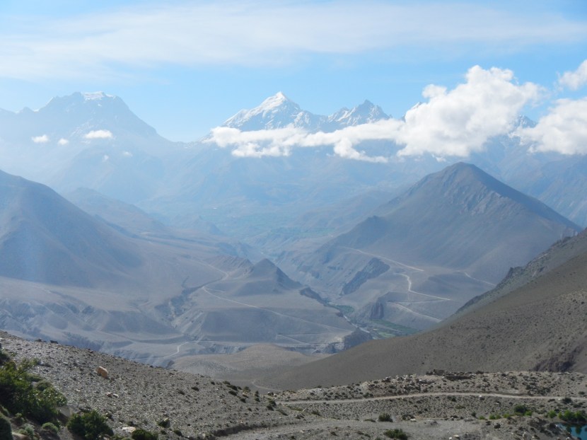 View across the other side of the valley towards the Thorang Lar Pass (5415m) - the large U-shape in the background